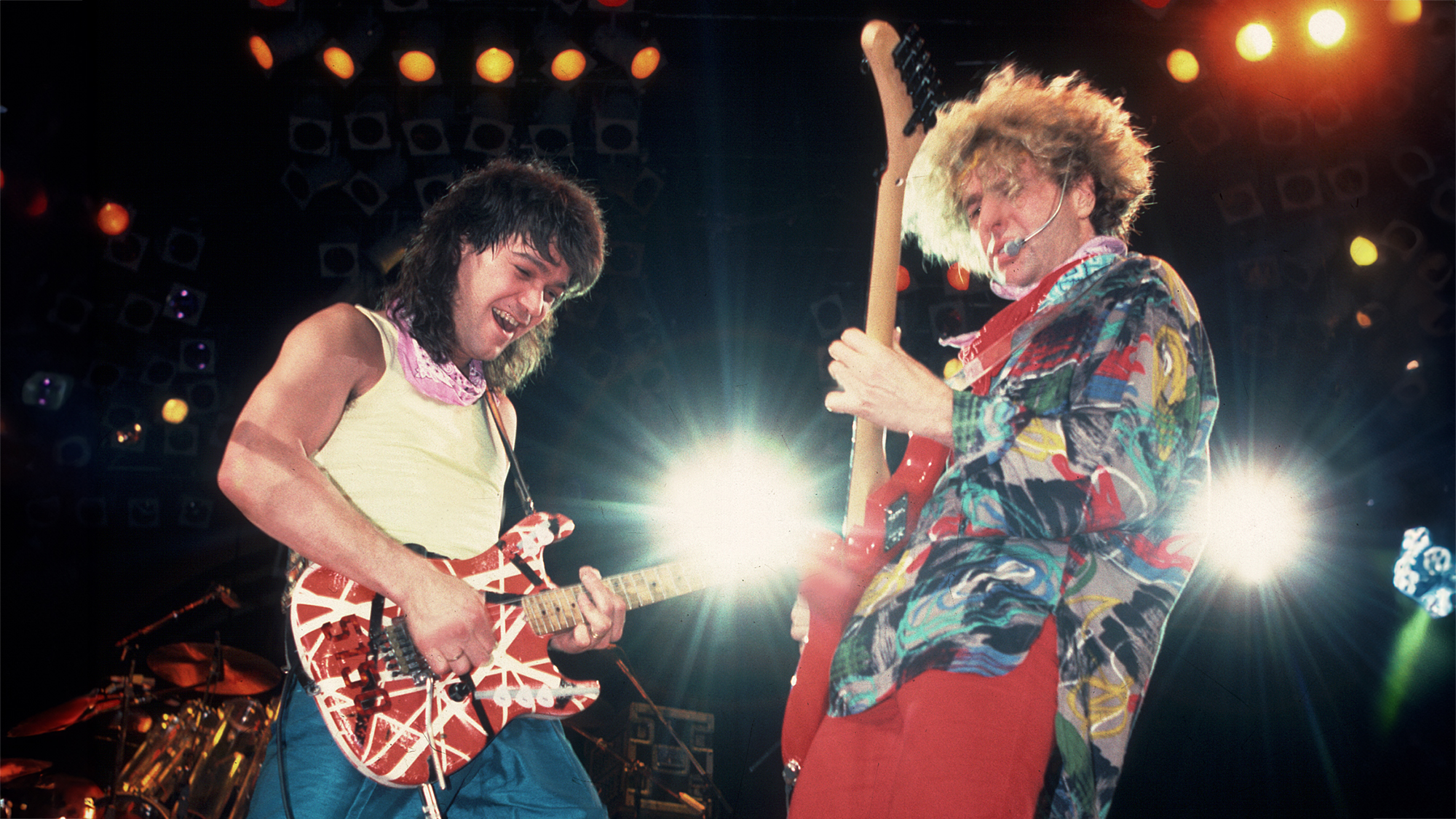 Rock musicians Sammy Hagar and Eddie Van Halen (1955 - 2020), both of the group Van Halen, perform onstage at the Metro Center, Rockford, Illinois, March 16, 1986.