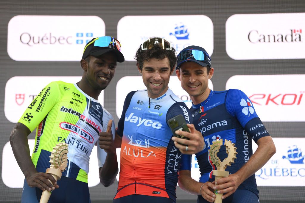 QUEBEC CITY QUEBEC SEPTEMBER 13 LR Biniam Girmay of Eritrea and Team Intermarche Wanty on second place race winner Michael Matthews of Australia and Team Jayco AlUla and Rudy Molard of France and Team Groupama FDJ on third place take a selfie on the podium ceremony after the 13th Grand Prix Cycliste de Quebec 2024 a 2016km one day race from Quebec City to Quebec City UCIWT on September 13 2024 in Quebec City Quebec Photo by Alex BroadwayGetty Images