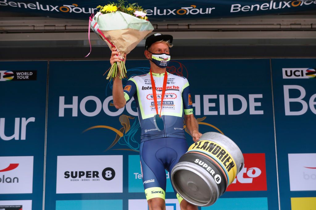 HOOGERHEIDE NETHERLANDS SEPTEMBER 01 Taco Van Der Hoorn of Netherlands and Team Intermarch Wanty Gobert Matriaux celebrates at podium as stage winner during the 17th Benelux Tour 2021 Stage 3 a 1683km stage from Essen to Hoogerheide BeneluxTour on September 01 2021 in Hoogerheide Netherlands Photo by Bas CzerwinskiGetty Images