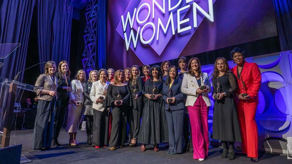 On stage at the March 21 Multichannel News Wonder Women of New York event at New York&rsquo;s Ziegfeld Ballroom (From l.): Kate Morgan, Gina Reduto, Tina Thornton, Stephanie Dorman, Ingrid Cipri&aacute;n-Matthews, Woman of Influence Sarah Kate Ellis, Adriana Waterston, Adrienne Roark, Lucilla D&rsquo;Agostino, Barbara Maushard, Kim Granito, Lindsey Woodland, Kavita Vazirani, co-host Victoria Arlen of ESPN, Laura Palumbo Johnson, Noga Rosenthal and Sheereen Russell.