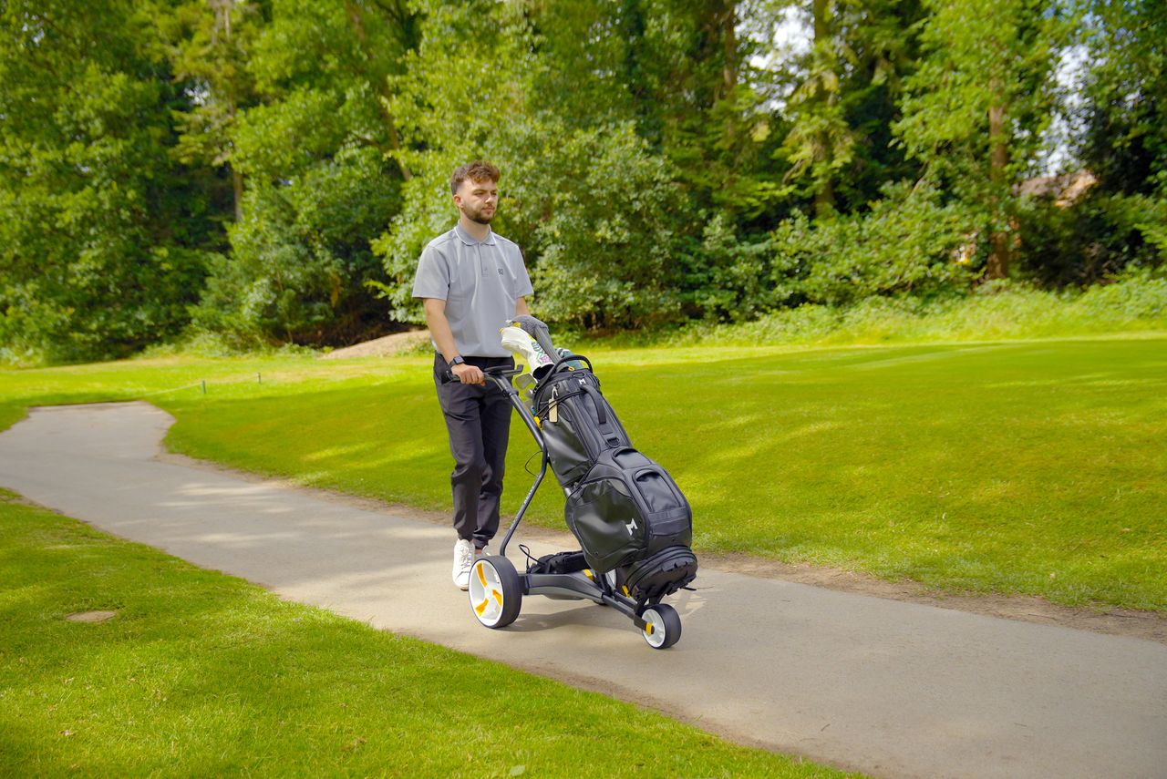 Dan Parker using a golf trolley with the Minimal Gaia TE1 cart bag