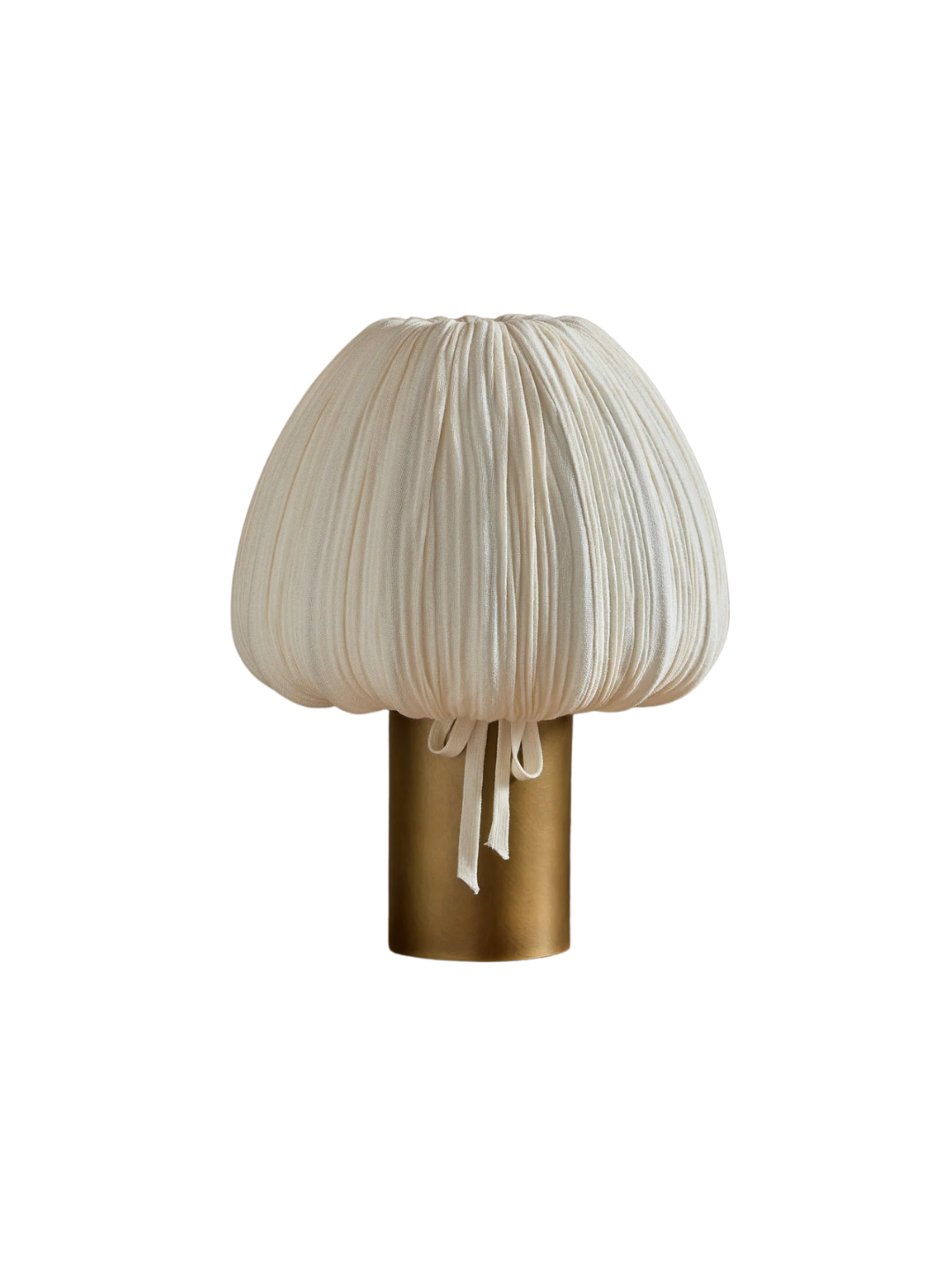 a table lamp with a pleated fabric shade and a brass base
