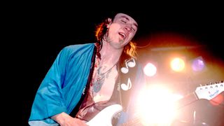 American musician Stevie Ray Vaughan plays guitar as he performs onstage at the Fireside Bowl, Chicago, Illinois, February 17, 1984.