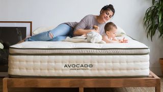 Avocado Green Mattress, featuring a woman and baby on said mattress 