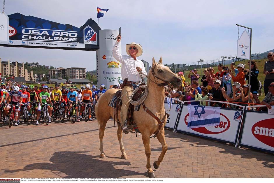 A cowboy gets the stage started at the US Pro Challenge