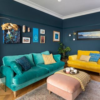 blue living room with green sofa