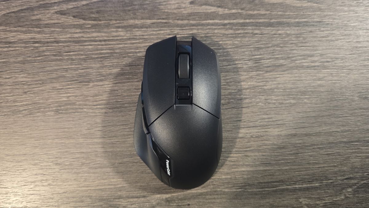 Powercolor Alphyn AM10 Wireless Gaming Mouse with RGB enabled on a desk.