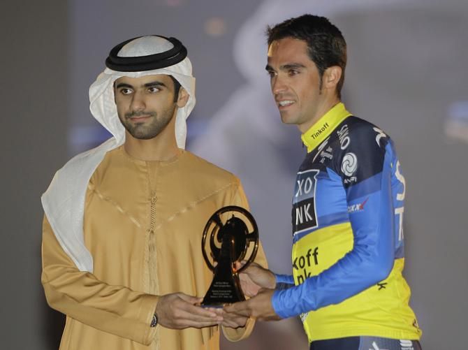 Sheikh Mansour bin Mohammed bin Rashid Al Maktoum, left, delivers an award to Alberto Contador