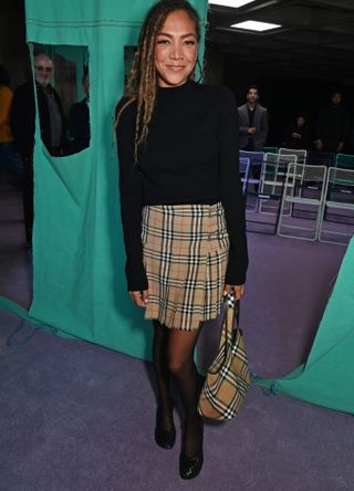 Miquita Oliver in Burberry skirt