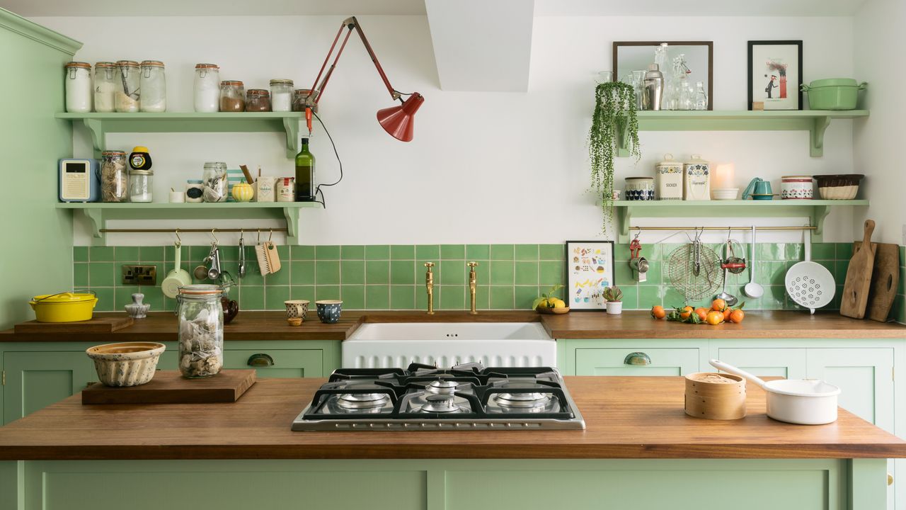 Green painted kitchen by deVOL