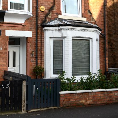 The front of a red brick town house