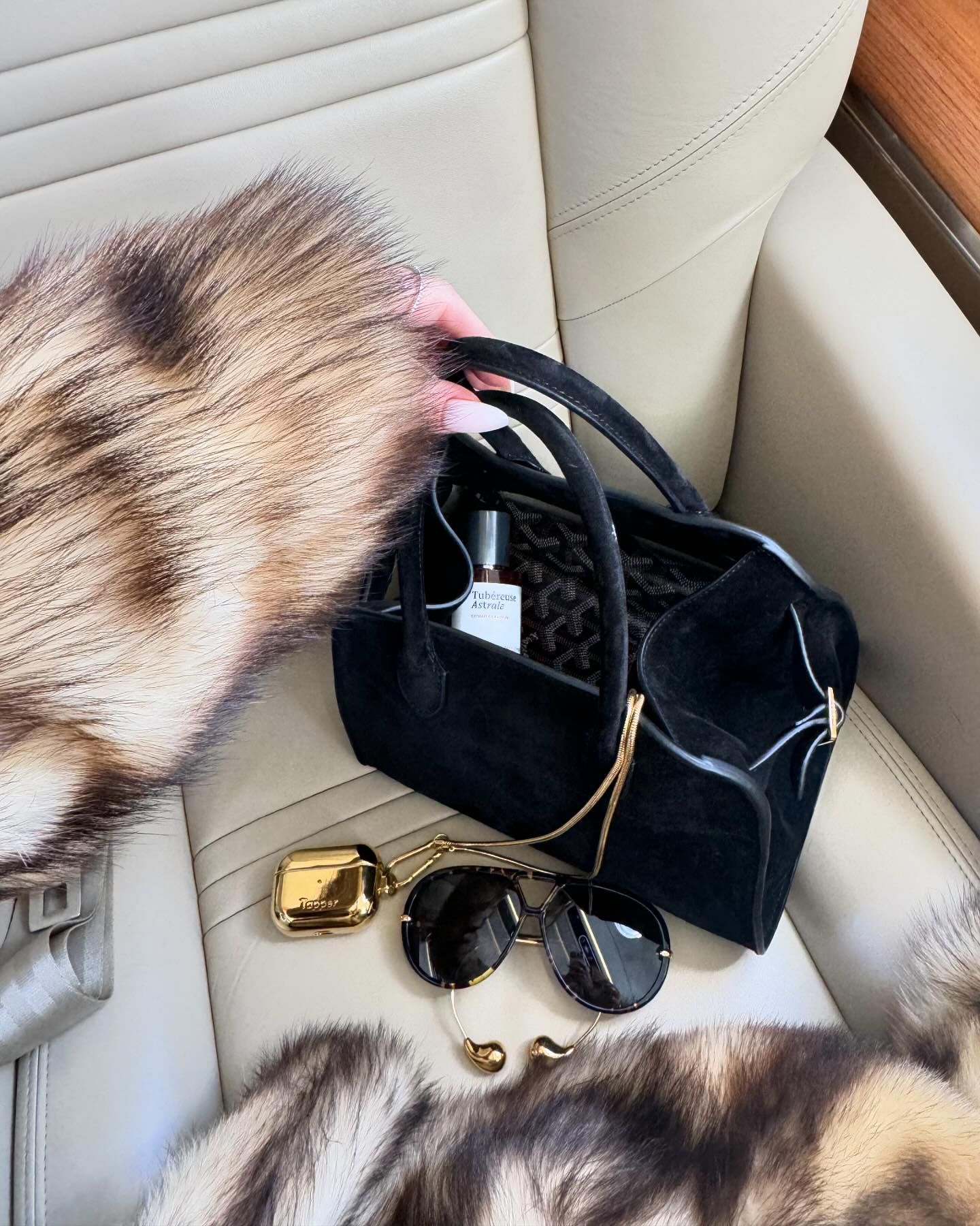 Rosie Huntington-Whiteley&#039;s The Row Margaux bag with a bottle of Maison Crivelli Tuberose Astrale perfume inside