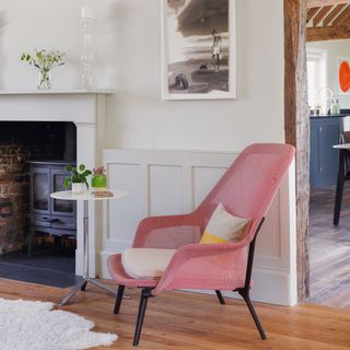 Pink armchair in snug in living room