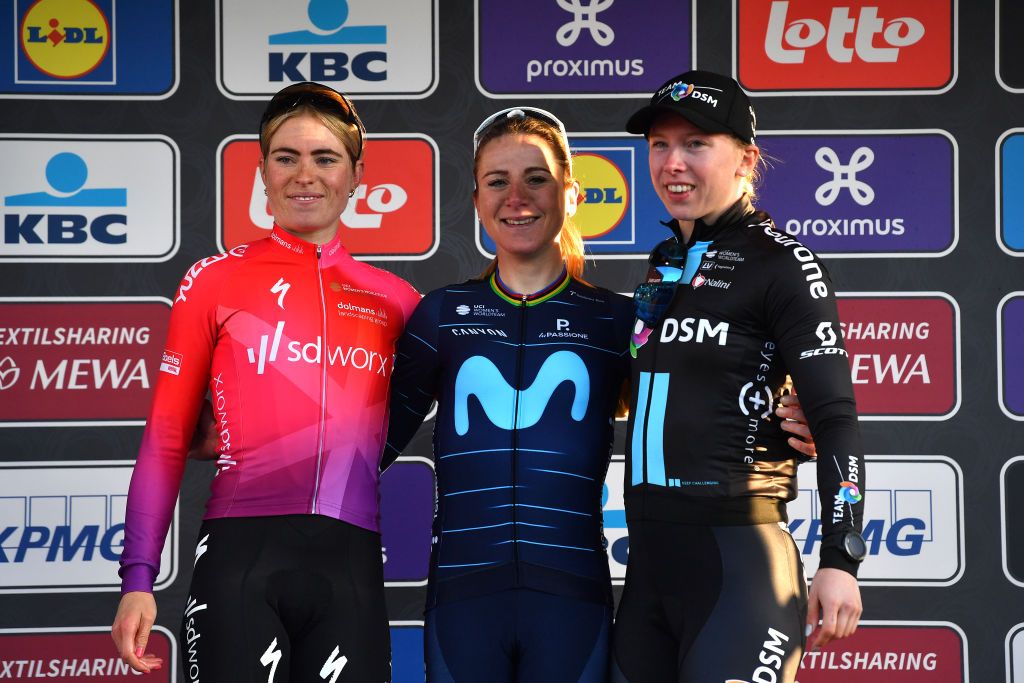 NINOVE BELGIUM FEBRUARY 26 LR Demi Vollering of Netherlands and Team SD Worx on second place race winner Annemiek Van Vleuten of Netherlands and Movistar Team Women and Lorena Wiebes of Netherlands and Team DSM Women on third place pose on the podium ceremony after the 17th Omloop Het Nieuwsblad 2022 Womens Race a 128km race from Ghent to Ninove OHN22 FlandersClassic WorldTour on February 26 2022 in Ninove Belgium Photo by Luc ClaessenGetty Images