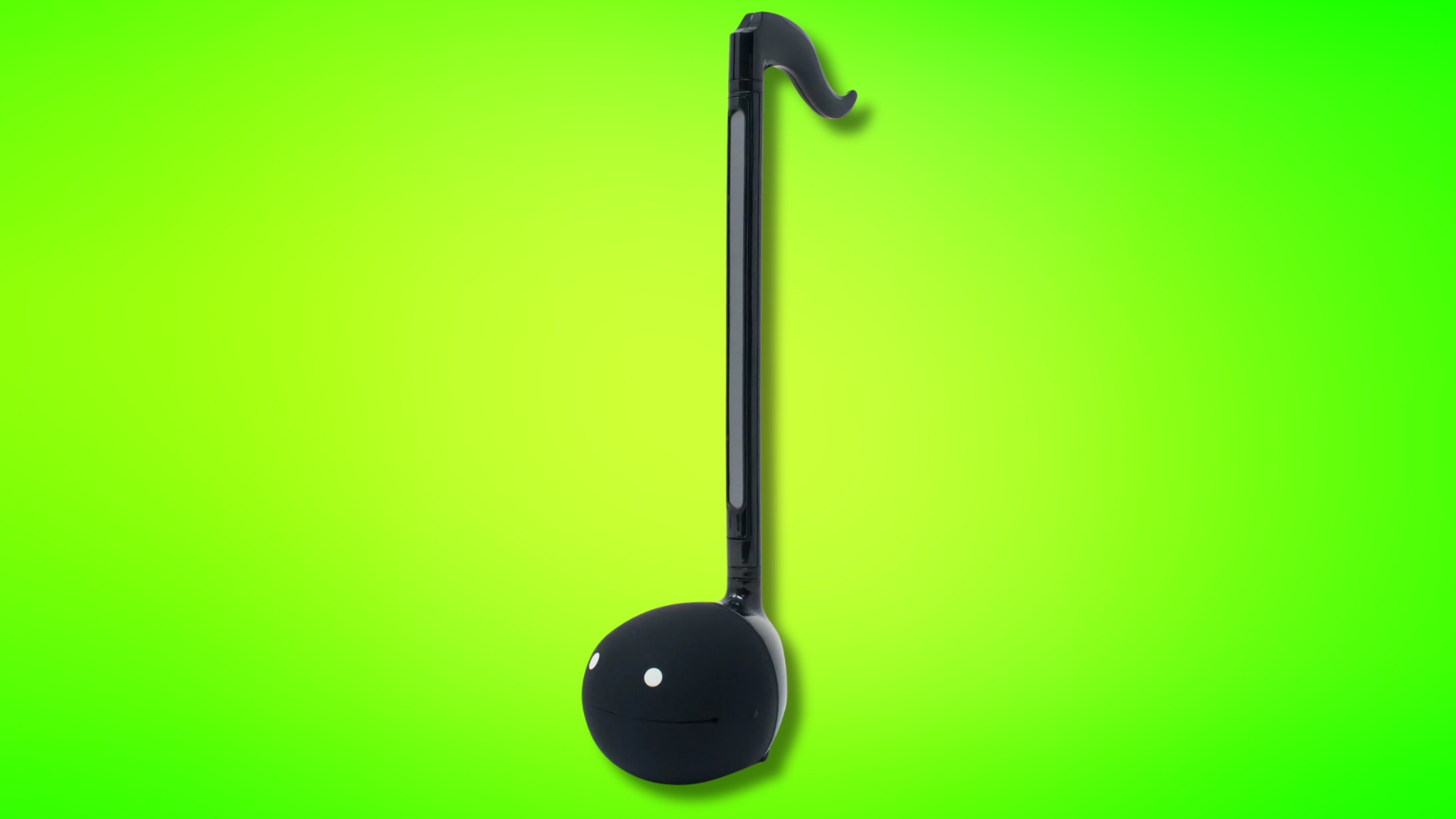 A black Otamatone synthesizer