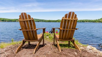 Wooden Adirondack chair at lake house