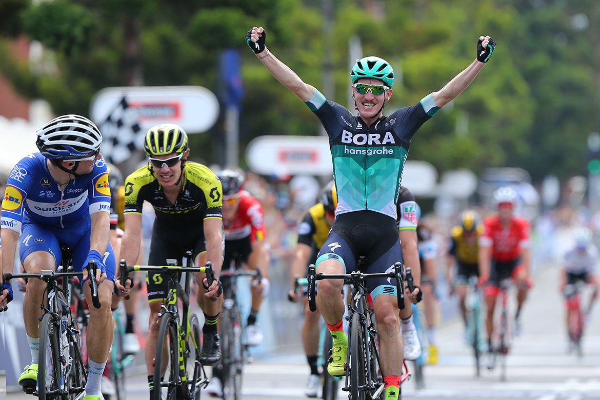 Elia Viviani looks back at Jay McCarthy celebrating the win