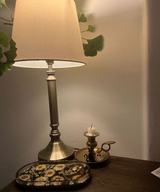 A bedside lamp with a philips hue bulb with warm light