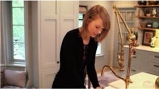 taylor swift in white room and walled shelves