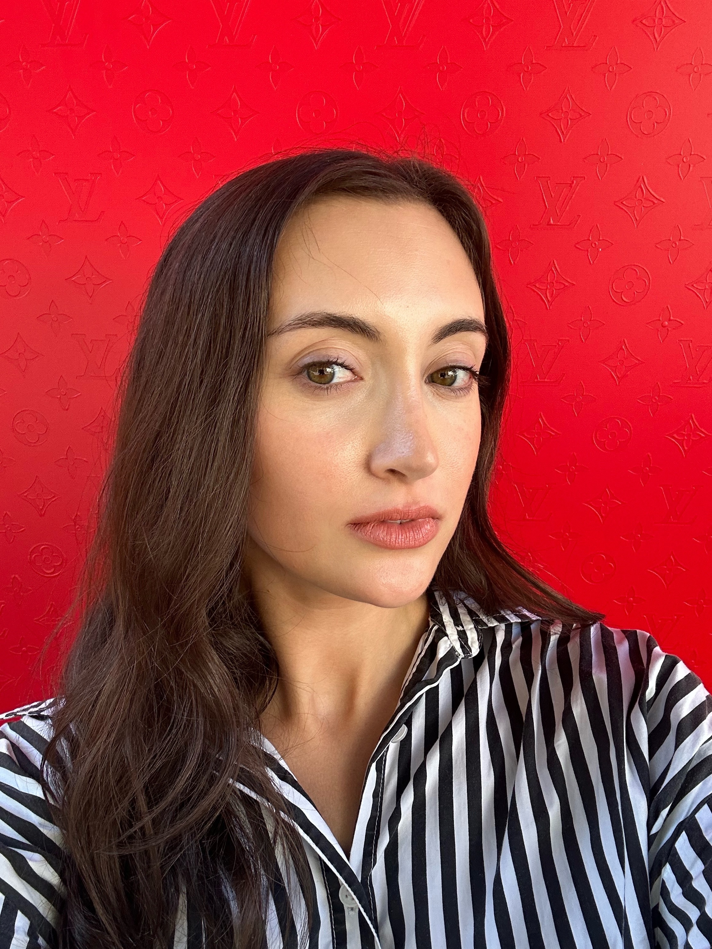 Associate beauty editor Alyssa Brascia wearing the Louis Vuitton Beauty LV Rouge Matte Lipstick in Nude N&amp;eacute;cessaire.