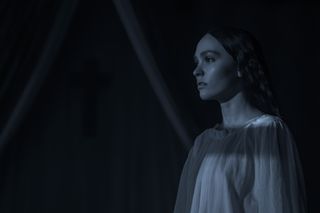 lily rose depp stares on the window as ellen hutter has a dream in nosferatu