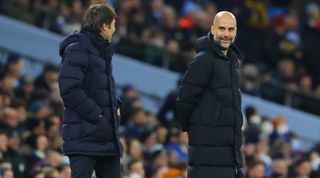 Tottenham Hotspur head coach Antonio Conte and Manchester City manager Pep Guardiola on the touchline during the Premier League match between Manchester City and Tottenham Hotspur on 19 February, 2022 at the Etihad Stadium in Manchester, United Kingdom
