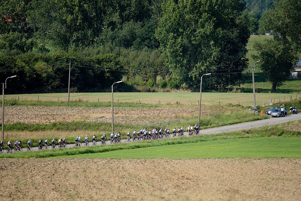 Peloton speed through the Flanders countryside at the 108 km Stage 2 of the Lotto Belgium Tour 2016