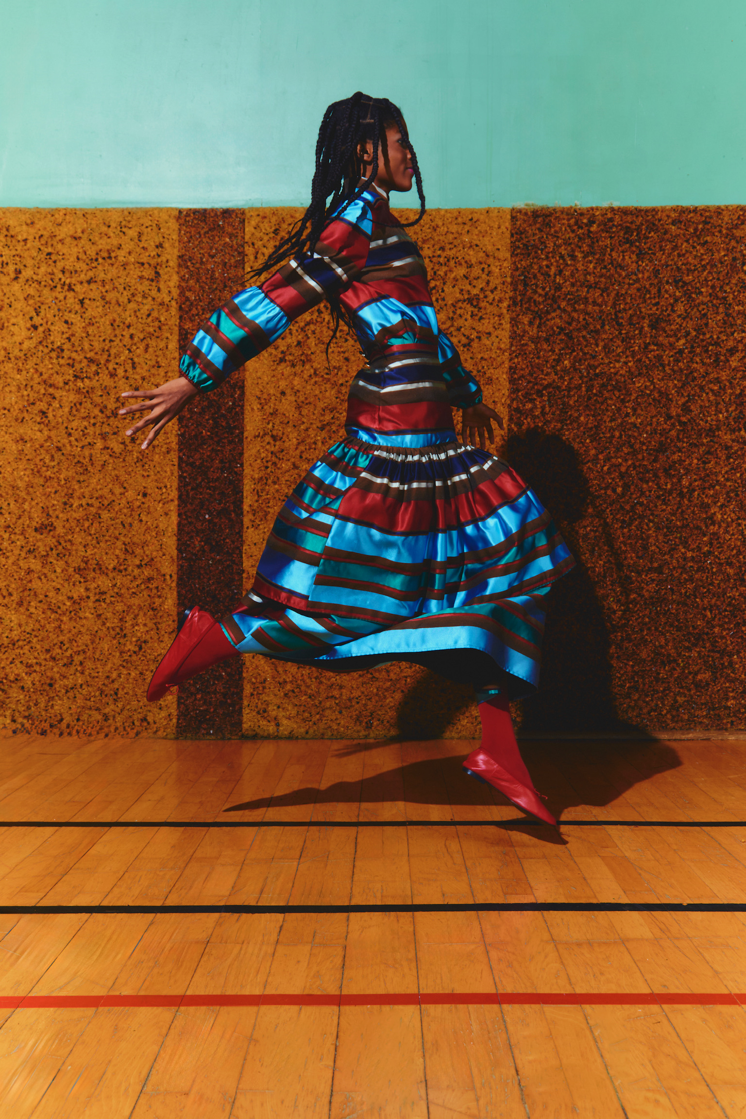a photo of a model wearing a striped dress from the maria de la orden autumn winter 2025 campaign