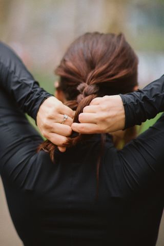 Julia Marzovilla braiding her hair