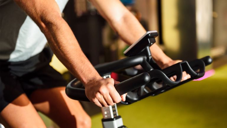 Are exercise bikes good for back pain?: Image shows man using the best exercise bike