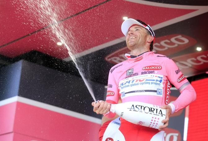 New Giro race leader Luca Paolini (Katusha) celebrates on the podium