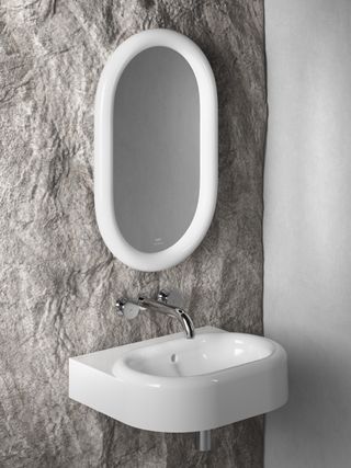 bathroom basin and oval mirror on textured wall, VitrA Liquid range by Tom Dixon