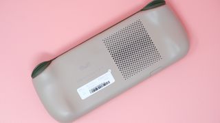 Ayaneo Air 1S handheld gaming PC on a pink background.