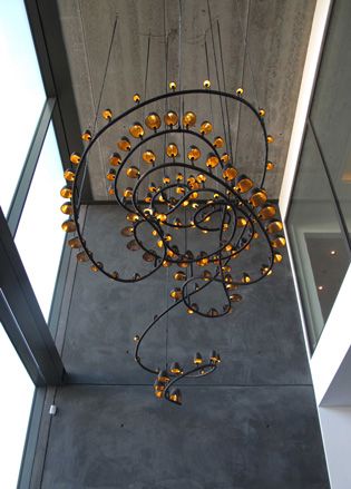 Chandelier with black frame and golden bulbs