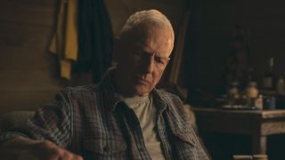 Mark Harmon's older Gibbs on NCIS: Origins sitting in his cabin pouring a drink for himself