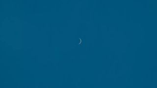 Venus as a razor-thin crescent as it nears inferior conjunction with the sun.