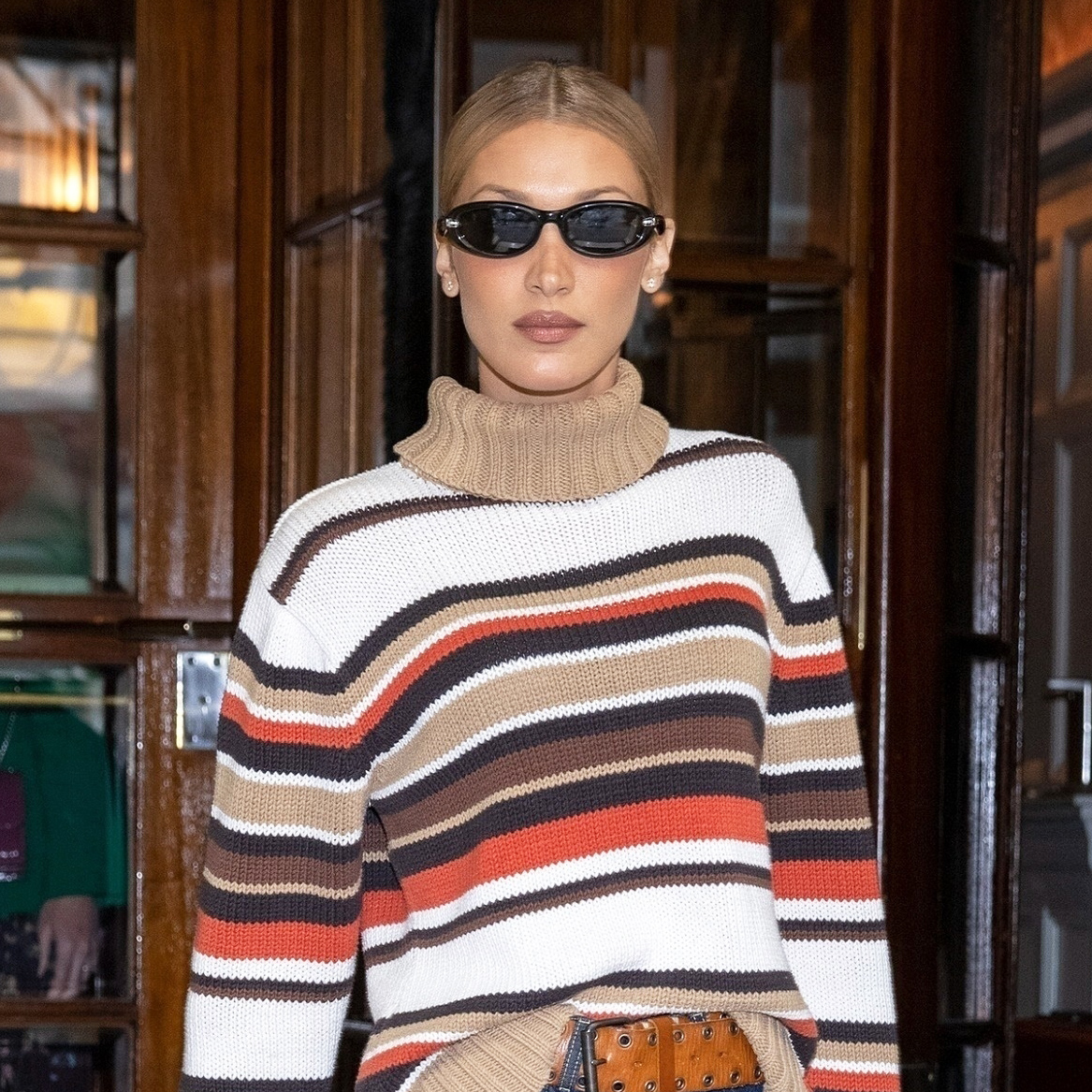 Bella Hadid wearing a striped sweater in London