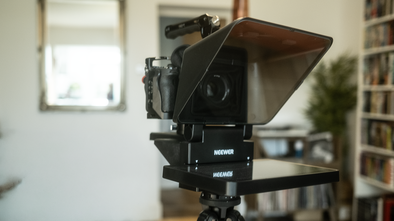 An X11 teleprompter on a tripod