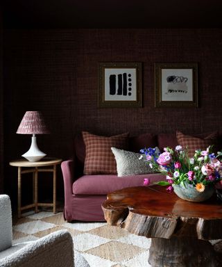 Dark brown living room with textured wallpaper and checkered rug