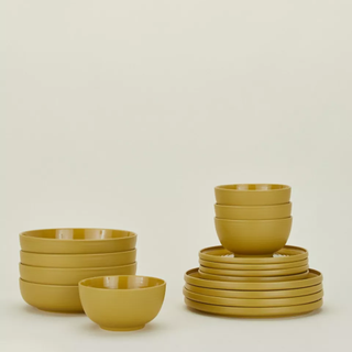 yellow 16-piece dinnerware set with bowls and plates