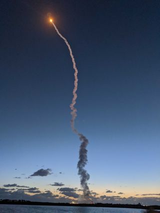 The Atlas V rocket carrying Boeing's Starliner spacecraft soars into the morning sky over Cape Canaveral Air Force Station in Florida. 