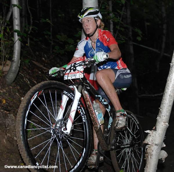 Heather Irmiger grits her teeth on the dark, muddy path.