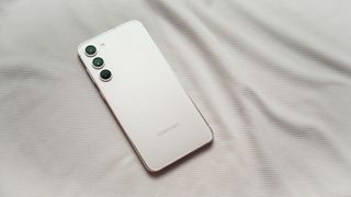 Angled view of Samsung Galaxy S23 Plus against white background