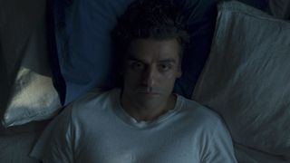 Oscar Isaac lies in bed in Moon Knight