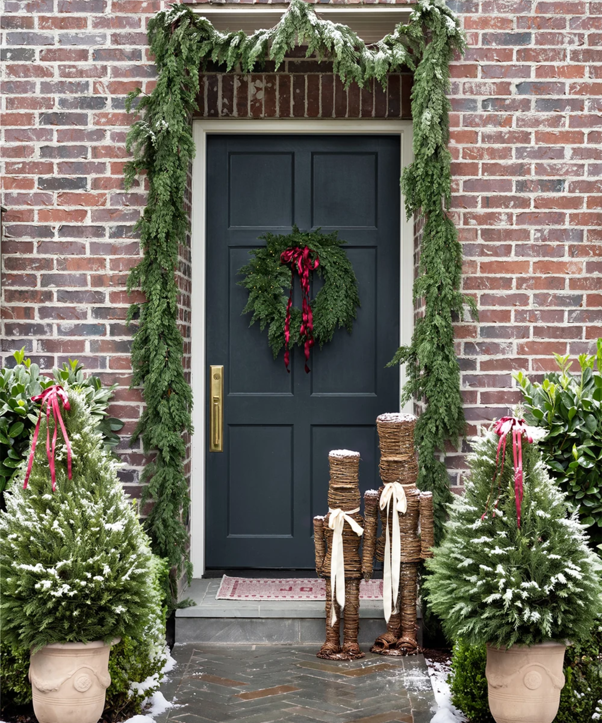 a porch decorated for Christmas