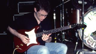 Marshall Crenshaw plays guitar during a soundcheck rehearsal onstage at the nightclub My Father's Place, Roslyn, New York, June 26, 1982.