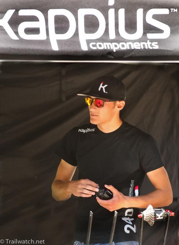 Brady Kappius watches the racers take off from his Kappius Components booth