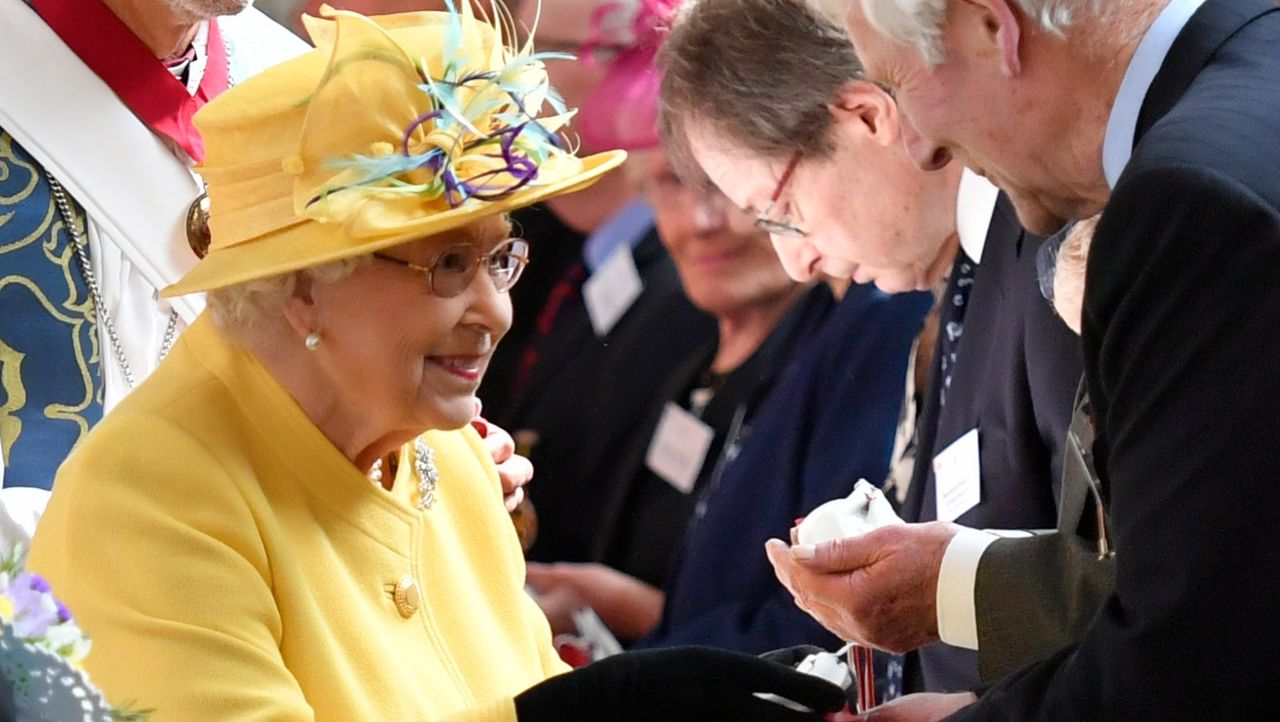 Queen Elizabeth II distributes the Maundy money during the Royal Maundy Service at St George&#039;s Chapel in Windsor, west of London on April 18, 2019. 