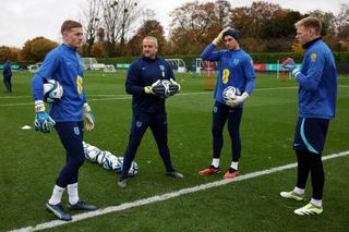 ordan Pickford, Martyn Margetson, Goalkeeping Coach of England, Sam Johnstone and Aaron Ramsdale of England speak during an England Training Session at Tottenham Hotspur Training Centre on November 18, 2023 in Enfield, England