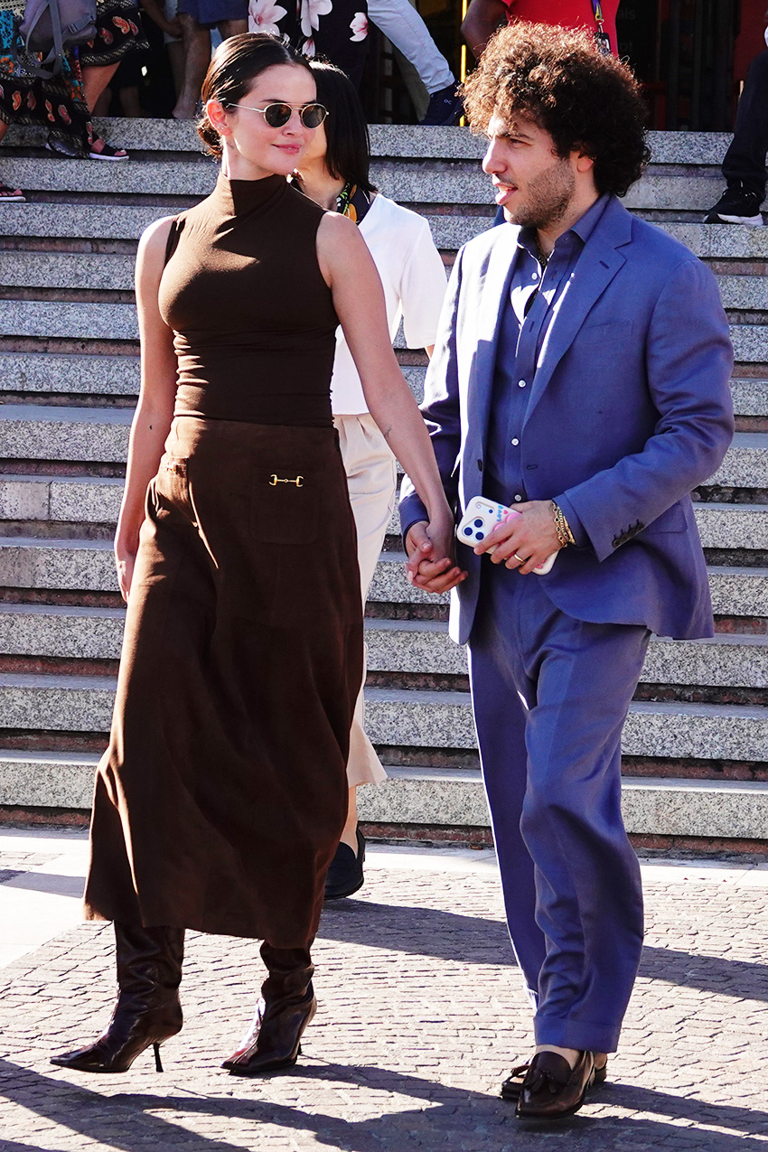 Selena Gomez with Benny Blanco in Venice, where she wore a brown tank and brown Rixo skirt with slouchy witchy boots